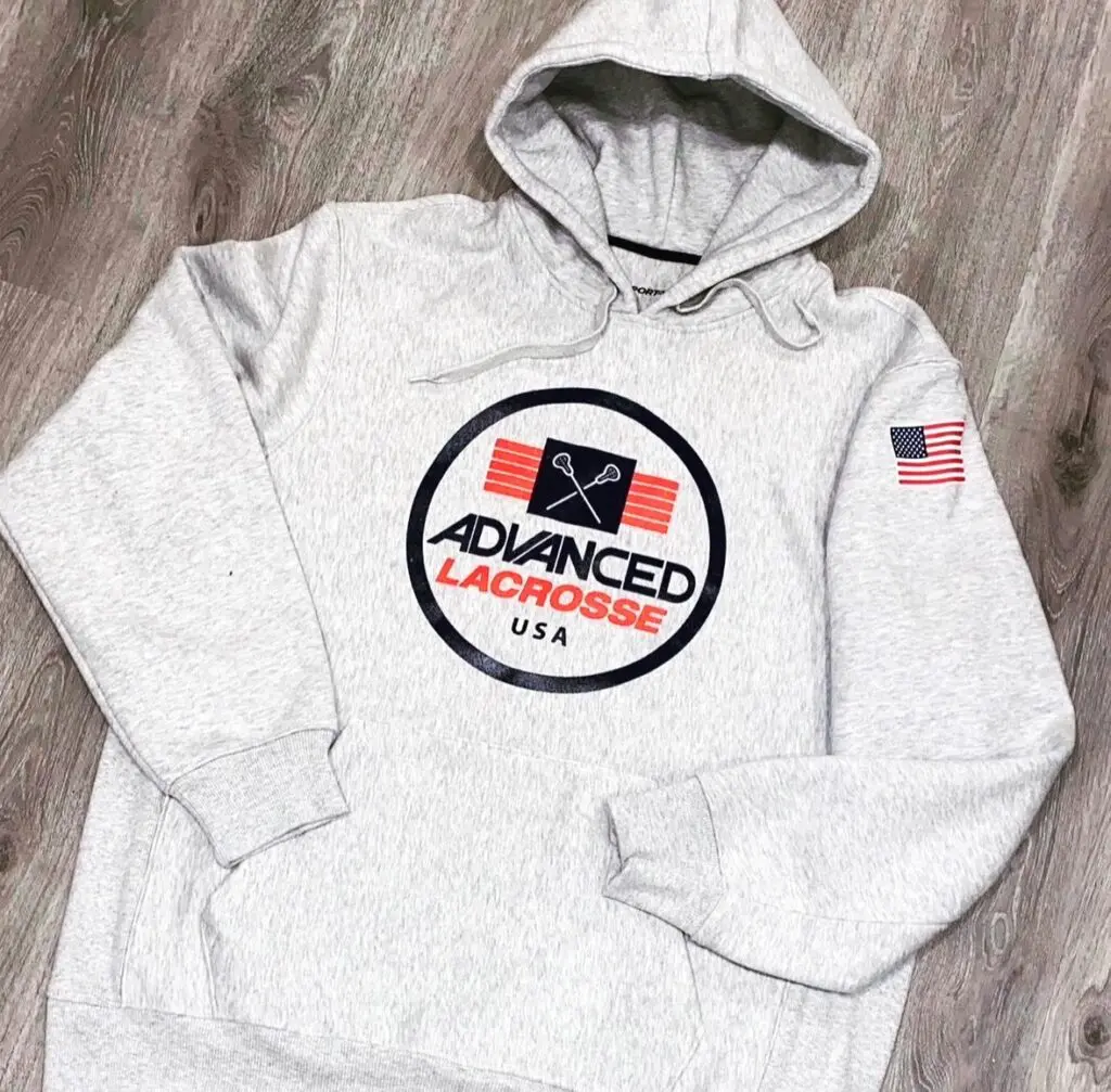 A white hoodie with an american flag on the front.