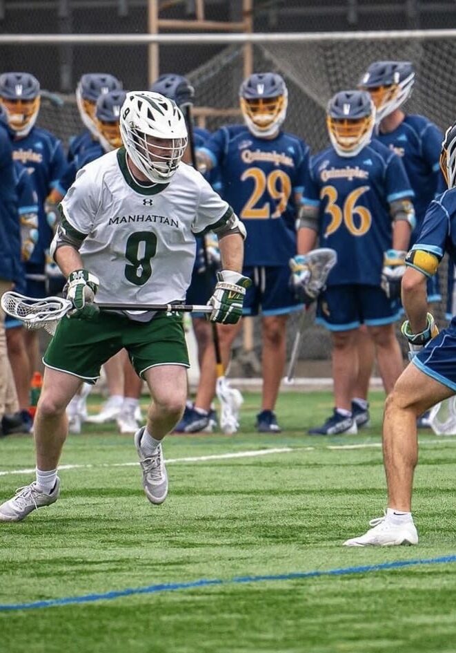 A group of men playing lacrosse on a field.